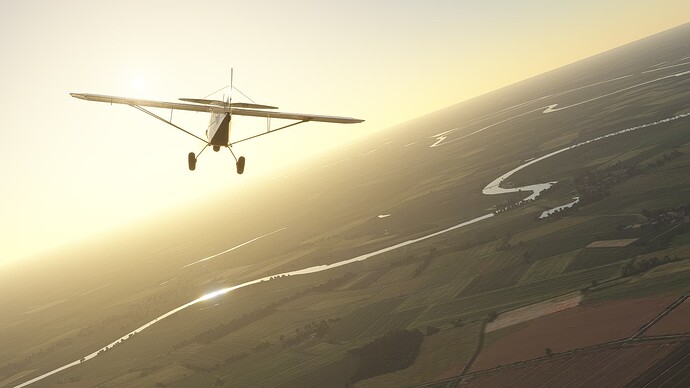 Cub Crafters X above German rural, plain fields